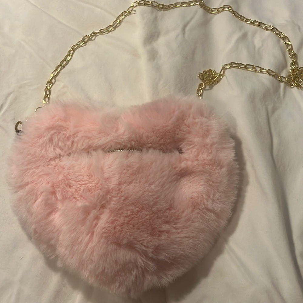 This is a light pink purse never worn.